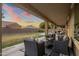 Covered patio with comfortable seating and backyard view at 7616 S Sorrell Ln, Gilbert, AZ 85298
