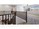 Open staircase leading to a bright upper level, with railing details overlooking the downstairs living area at 7616 S Sorrell Ln, Gilbert, AZ 85298