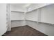 Bright walk-in closet featuring ample shelving and storage space, great for organization at 7616 S Sorrell Ln, Gilbert, AZ 85298