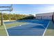 Outdoor basketball court area surrounded by fencing and lush green plants at 906 Leisure World --, Mesa, AZ 85206