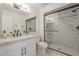 Contemporary bathroom with a glass-enclosed shower and marble accents at 906 Leisure World --, Mesa, AZ 85206
