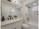 Bathroom featuring tiled shower, white marble countertops, matte black hardware and a window for light at 906 Leisure World --, Mesa, AZ 85206