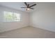 Bedroom featuring ceiling fan, carpet floors, window letting in natural light, and electrical outlets at 906 Leisure World --, Mesa, AZ 85206