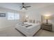 Comfortable bedroom with a plush bed, neutral decor, and a ceiling fan at 906 Leisure World --, Mesa, AZ 85206