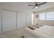 Bright bedroom with a large closet for ample storage and ceiling fan at 906 Leisure World --, Mesa, AZ 85206