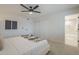 Cozy bedroom with a view into the en suite bathroom, featuring plenty of natural light at 906 Leisure World --, Mesa, AZ 85206