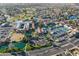 A neighborhood aerial shot with a golf course, community center, tennis courts, and lush landscaping at 906 Leisure World --, Mesa, AZ 85206