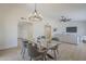 Open dining area with a glass table perfect for Gathering gatherings and entertaining at 906 Leisure World --, Mesa, AZ 85206