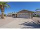 Tan home with a desert rock yard, front patio cover and driveway leading to the attached garage at 906 Leisure World --, Mesa, AZ 85206