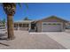 Charming single-story home featuring desert landscaping, a covered front patio, and an attached two-car garage at 906 Leisure World --, Mesa, AZ 85206