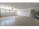 Garage featuring epoxy floors, garage door and water heater at 906 Leisure World --, Mesa, AZ 85206