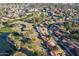 A golf course winds through a residential community with scenic ponds and mature trees at 906 Leisure World --, Mesa, AZ 85206