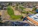 An elevated view of a golf course with greens, sand traps, and manicured fairways at 906 Leisure World --, Mesa, AZ 85206