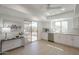 Bright kitchen with white cabinets, stainless steel appliances, and sliding door to a covered patio at 906 Leisure World --, Mesa, AZ 85206