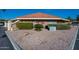 Remax Classic office building with rock landscaping, shrubs, and trees at 906 Leisure World --, Mesa, AZ 85206