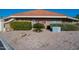 View of Remax Classic office building with rock landscaping, shrubs, and trees at 906 Leisure World --, Mesa, AZ 85206