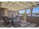 Covered outdoor patio featuring a table and chairs, perfect for dining and relaxing in the shade at 906 Leisure World --, Mesa, AZ 85206