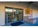 Entrance to shop, featuring window views, brick decor and outdoor signage at 906 Leisure World --, Mesa, AZ 85206