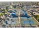 Aerial view of multiple outdoor tennis courts with blue canopies in a gated community at 906 Leisure World --, Mesa, AZ 85206