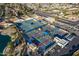 Aerial view of multiple tennis and pickleball courts with blue canopies and surrounding neighborhood at 906 Leisure World --, Mesa, AZ 85206