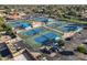 Aerial view of a tennis court complex featuring multiple courts, shaded seating, and convenient parking at 906 Leisure World --, Mesa, AZ 85206