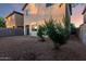 The backyard features gravel landscaping, and partial privacy fencing at 10225 W Camelback Rd # 33, Phoenix, AZ 85037
