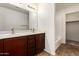 Bathroom featuring a double sink vanity with brown cabinets, and tile flooring at 10225 W Camelback Rd # 33, Phoenix, AZ 85037