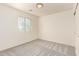 This carpeted bedroom features a window that brings in natural light at 10225 W Camelback Rd # 33, Phoenix, AZ 85037