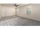 Spacious bedroom with carpet, ceiling fan, and natural light from two windows at 10225 W Camelback Rd # 33, Phoenix, AZ 85037