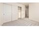 The bedroom features a closet with sliding doors and neutral carpet at 10225 W Camelback Rd # 33, Phoenix, AZ 85037