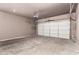 Spacious two-car garage with an automatic door opener and ample room for vehicles and storage at 10225 W Camelback Rd # 33, Phoenix, AZ 85037