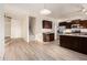 Open kitchen featuring stainless appliances, granite countertops, and stairs to the second floor at 10225 W Camelback Rd # 33, Phoenix, AZ 85037