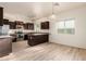 Well-lit kitchen with modern appliances, brown cabinets, and plenty of counter space at 10225 W Camelback Rd # 33, Phoenix, AZ 85037