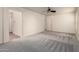 Spacious main bedroom features neutral carpet, a ceiling fan, and an ensuite bathroom at 10225 W Camelback Rd # 33, Phoenix, AZ 85037