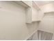 Walk-in closet providing ample storage space with multiple shelves and rods at 10225 W Camelback Rd # 33, Phoenix, AZ 85037