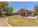 A sprawling backyard with a well-maintained lawn and lush landscaping at 10318 E Plata Ave, Mesa, AZ 85212