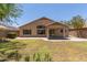 Lush backyard featuring a well-manicured lawn and charming outdoor living space at 10318 E Plata Ave, Mesa, AZ 85212