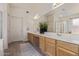 The Primary bathroom is spacious and features a soaking tub and double sinks at 10318 E Plata Ave, Mesa, AZ 85212