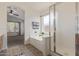 Bright Primary bathroom featuring soaking tub, separate glass shower, and natural light at 10318 E Plata Ave, Mesa, AZ 85212