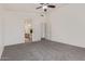 This bedroom features carpeted floors and an ensuite bath with dual sinks at 10318 E Plata Ave, Mesa, AZ 85212