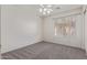 This bedroom features a ceiling fan and a window providing natural light at 10318 E Plata Ave, Mesa, AZ 85212