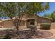 Charming one-story home showcasing a tile roof and lovely desert landscaping at 10318 E Plata Ave, Mesa, AZ 85212