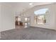 Spacious living room offering an open layout with archways and a view to the kitchen at 10318 E Plata Ave, Mesa, AZ 85212