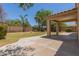Spacious covered patio overlooking the lush backyard and mature trees at 10318 E Plata Ave, Mesa, AZ 85212