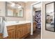 Bathroom with double sinks, an open door leading to the shower, and a modern framed mirror at 1263 W Del Rio St, Chandler, AZ 85224