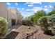 Lovely backyard with desert landscaping and a view of green trees and blue sky with white clouds at 12642 N Mountainside Dr # D, Fountain Hills, AZ 85268