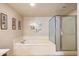Well-lit bathroom features a soaking tub with a shower stall, and tile floors at 12642 N Mountainside Dr # D, Fountain Hills, AZ 85268