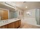 Spacious bathroom with double sinks, soaking tub, glass shower, and ample lighting at 12642 N Mountainside Dr # D, Fountain Hills, AZ 85268
