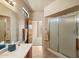 Bathroom features a vanity with a large mirror and a separate glass door shower at 12642 N Mountainside Dr # D, Fountain Hills, AZ 85268
