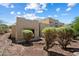Attractive southwestern home featuring a flat roof and desert landscaping on a bright, sunny day at 12642 N Mountainside Dr # D, Fountain Hills, AZ 85268